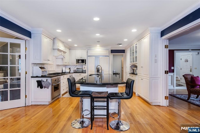38 Farley Pl, Allendale, NJ 07401 - kitchen with premium range hood, appliances with stainless steel finishes, a sink, and light wood-style floors