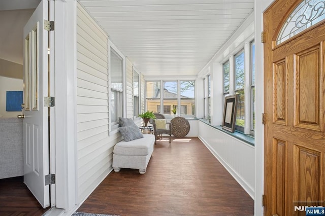 sunroom featuring wood finished floors