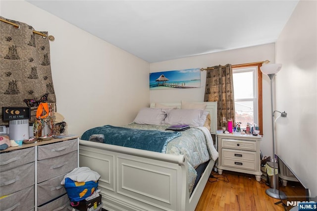 bedroom with light wood-style floors