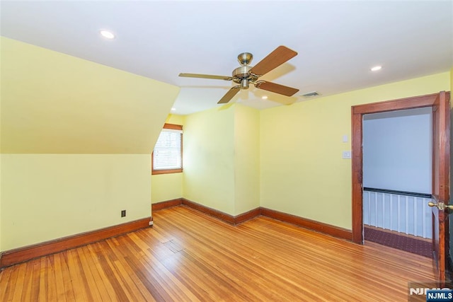 additional living space with baseboards, a ceiling fan, recessed lighting, and light wood-type flooring