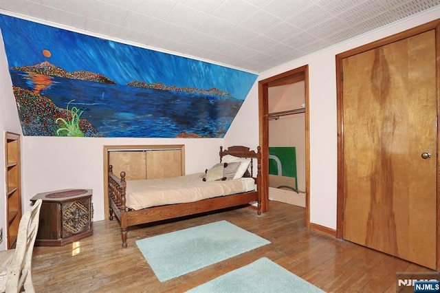 bedroom featuring wood finished floors