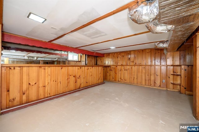 below grade area featuring wood walls