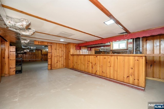 below grade area featuring wood walls