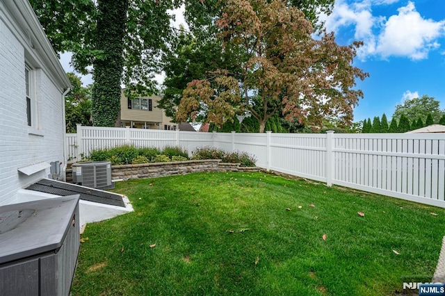 view of yard featuring cooling unit and a fenced backyard