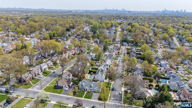 birds eye view of property with a residential view