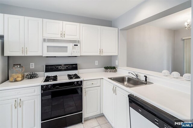 2304 Wendover Dr, Pequannock Township, NJ 07444 - kitchen with a sink, light tile patterned flooring, white appliances, white cabinetry, and light countertops