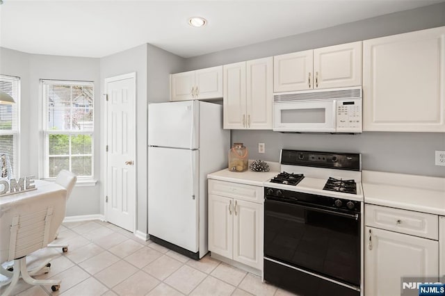 2304 Wendover Dr, Pequannock Township, NJ 07444 - kitchen featuring recessed lighting, white appliances, light tile patterned floors, light countertops, and white cabinetry