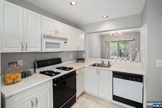 2304 Wendover Dr, Pequannock Township, NJ 07444 - kitchen featuring a chandelier, white appliances, white cabinets, and a sink
