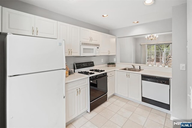 2304 Wendover Dr, Pequannock Township, NJ 07444 - kitchen featuring white cabinets, white appliances, light countertops, and an inviting chandelier