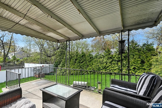 view of patio featuring fence