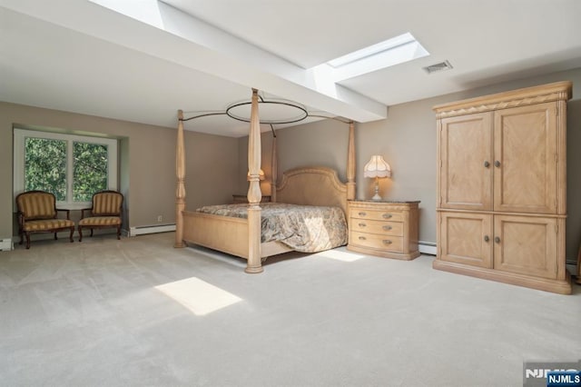 bedroom with baseboard heating, visible vents, a skylight, and light carpet