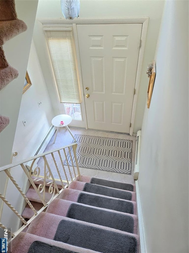 staircase with tile patterned floors