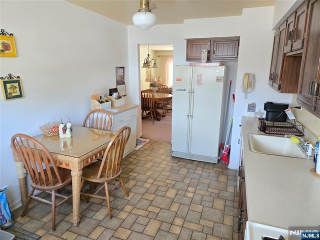 dining area with brick patterned floor