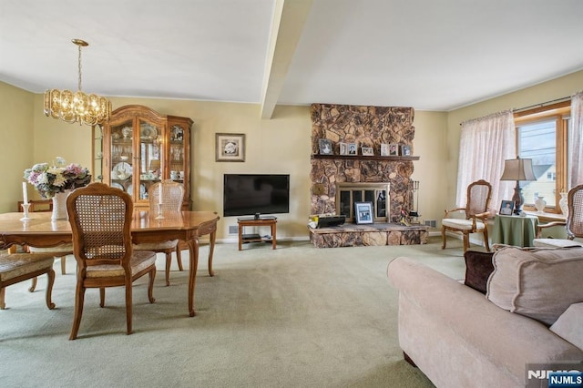 living room featuring carpet floors, a chandelier, a stone fireplace, baseboards, and beam ceiling