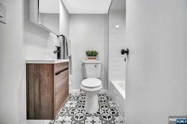 full bath with shower / bathtub combination, baseboards, toilet, tile patterned floors, and vanity