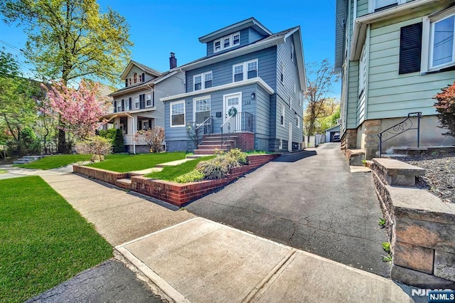 traditional style home with a front yard