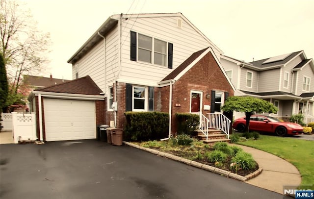 view of front of property with aphalt driveway and brick siding