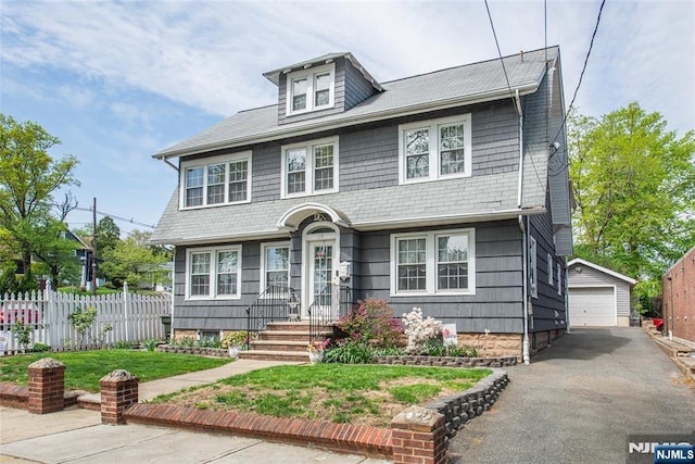 117 Saint Marys Pl, Nutley, NJ 07110 - american foursquare style home with fence, a front lawn, an outdoor structure, and a garage