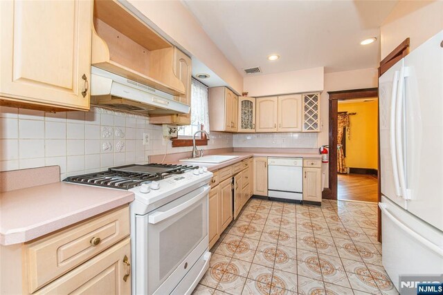 117 Saint Marys Pl, Nutley, NJ 07110 - kitchen with visible vents, a sink, white appliances, and light countertops