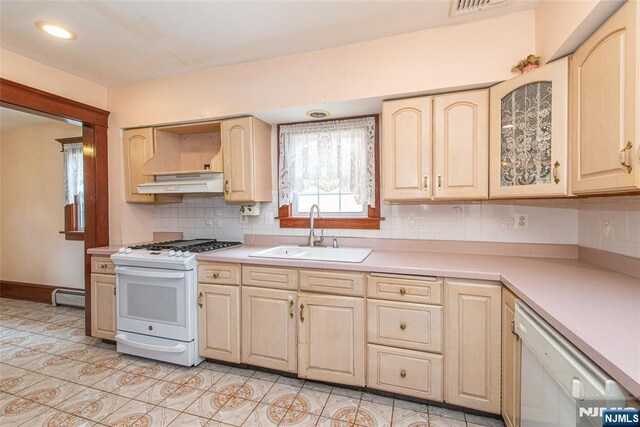117 Saint Marys Pl, Nutley, NJ 07110 - kitchen featuring a sink, white appliances, light countertops, under cabinet range hood, and a baseboard heating unit