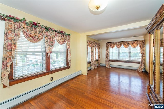 117 Saint Marys Pl, Nutley, NJ 07110 - unfurnished room featuring baseboards, visible vents, baseboard heating, and wood finished floors