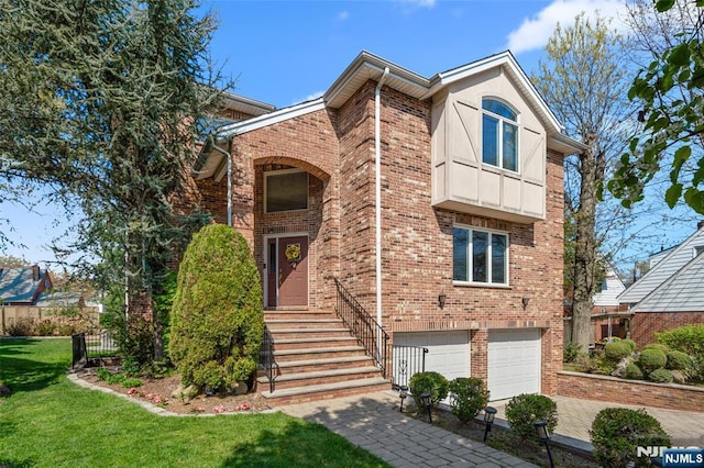 view of front facade with a garage, driveway, a front lawn, and brick siding