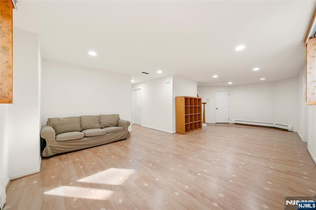 living area featuring recessed lighting, a baseboard radiator, baseboards, and wood finished floors