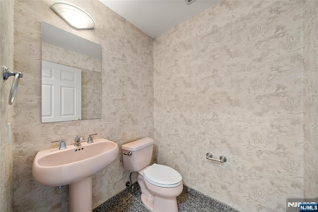 bathroom featuring toilet