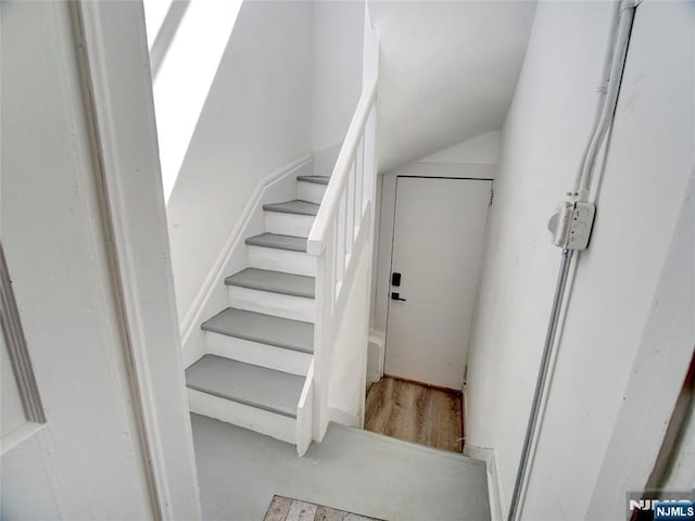 stairs with lofted ceiling