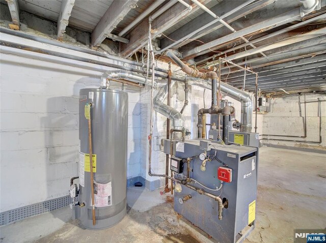 utility room with water heater and a heating unit