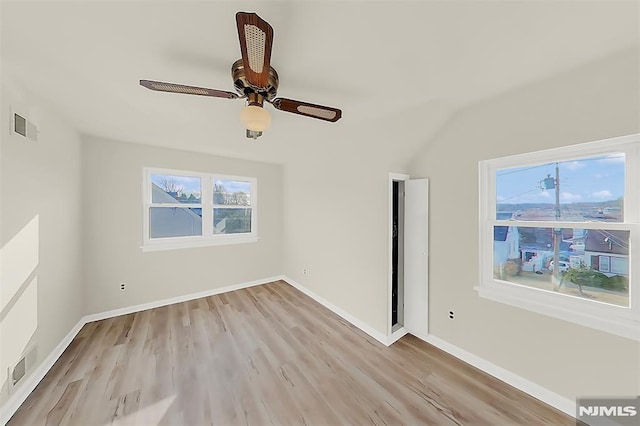 unfurnished room with visible vents, ceiling fan, and light wood finished floors