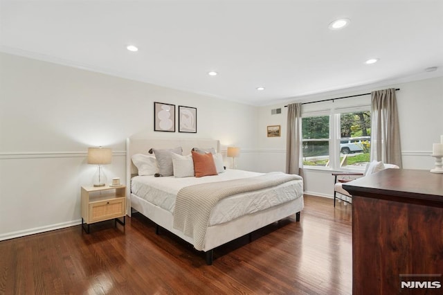 bedroom featuring dark wood-style floors, recessed lighting, and crown molding