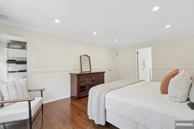 bedroom with recessed lighting, wood finished floors, and crown molding