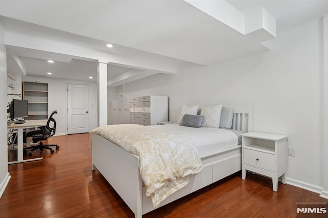 bedroom with baseboards, recessed lighting, and dark wood-type flooring