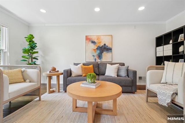 living area featuring ornamental molding, recessed lighting, and visible vents