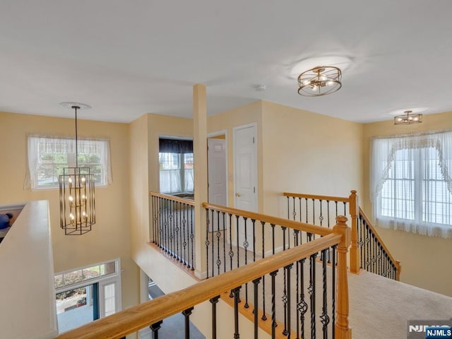 6 Knollwoods, Oakland, NJ 07436 - hall with an inviting chandelier, carpet, and an upstairs landing
