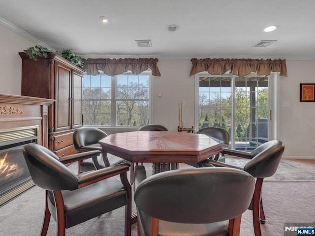 6 Knollwoods, Oakland, NJ 07436 - dining space with visible vents, ornamental molding, a warm lit fireplace, and carpet