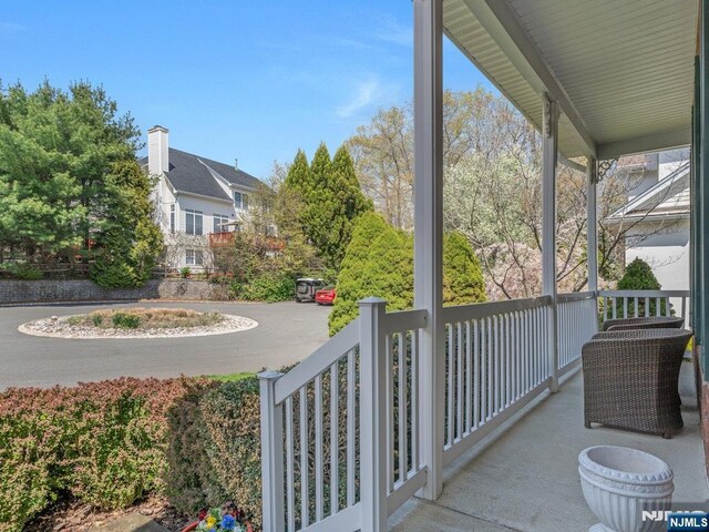 6 Knollwoods, Oakland, NJ 07436 - view of patio / terrace with covered porch