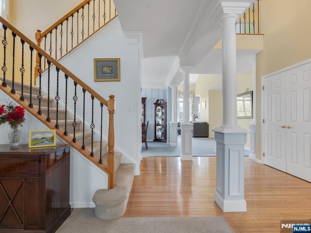 6 Knollwoods, Oakland, NJ 07436 - entryway featuring ornate columns, stairway, light wood-style floors, baseboards, and ornamental molding