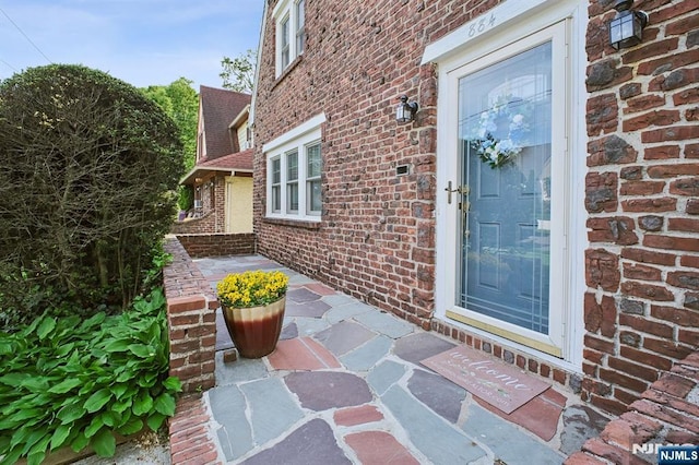 884 Helen St, Teaneck, NJ 07666 - doorway to property featuring brick siding