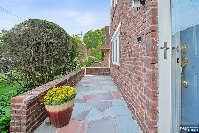 884 Helen St, Teaneck, NJ 07666 - view of property exterior featuring brick siding