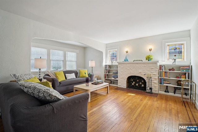 884 Helen St, Teaneck, NJ 07666 - living area with hardwood / wood-style flooring and a brick fireplace