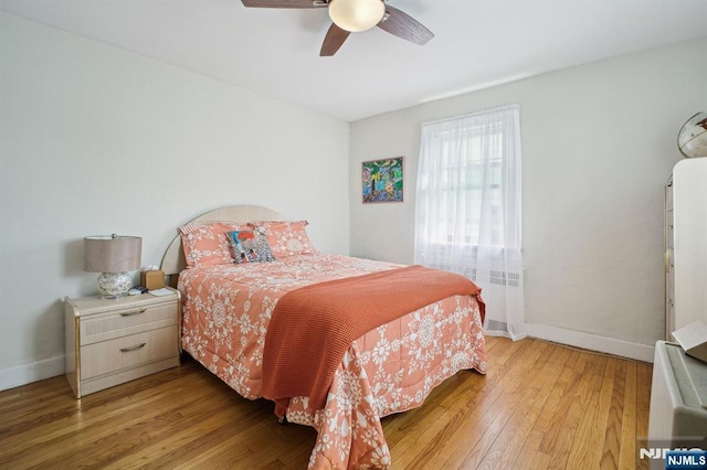 884 Helen St, Teaneck, NJ 07666 - bedroom featuring light wood-type flooring, baseboards, and a ceiling fan