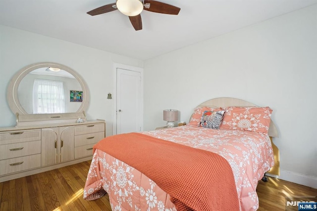 884 Helen St, Teaneck, NJ 07666 - bedroom featuring wood finished floors, a ceiling fan, and baseboards