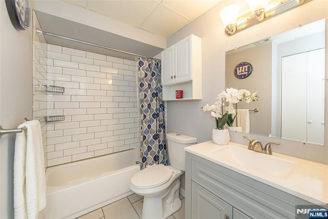 full bathroom with tile patterned floors, shower / bath combo, vanity, and toilet