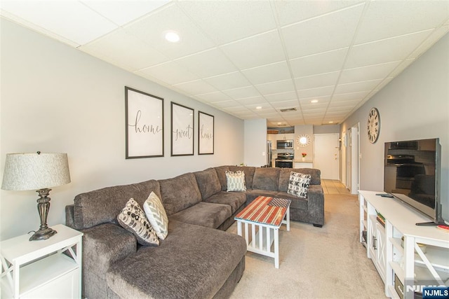 living room with visible vents, light carpet, recessed lighting, and a paneled ceiling