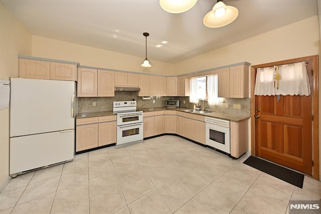 18 Radcliffe Ave, Woodland Park, NJ 07424 - kitchen with decorative backsplash, light brown cabinets, white appliances, under cabinet range hood, and a sink