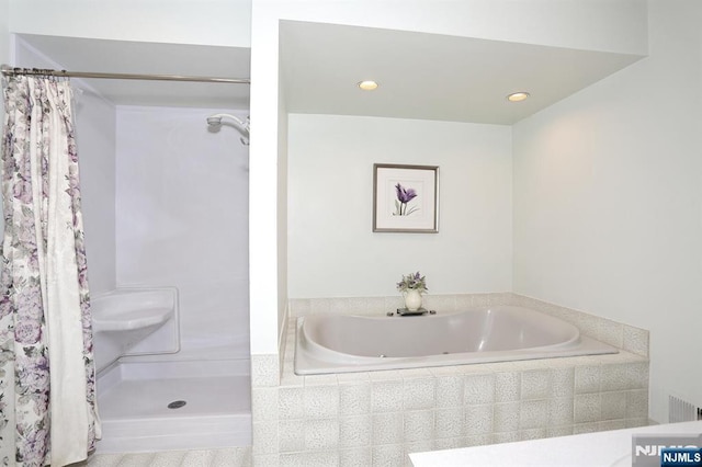 full bathroom featuring a garden tub, recessed lighting, and a shower with shower curtain