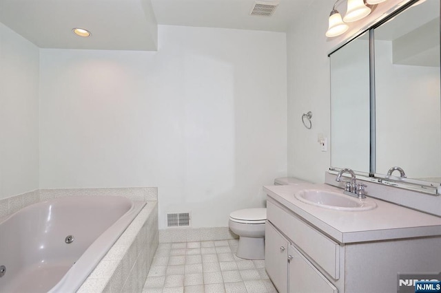 bathroom featuring a jetted tub, visible vents, toilet, and vanity