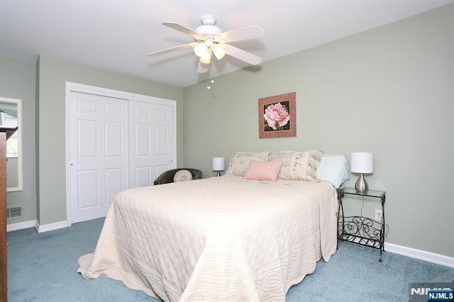bedroom with visible vents, ceiling fan, baseboards, a closet, and carpet